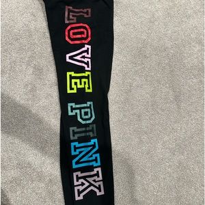 Black leggings by PINK with colorful lettering